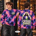 Two male models wearing a colorful tie-dye sweatshirt with a 'Jesus Christ' graphic, shown from both the front and back in a cafe setting.
