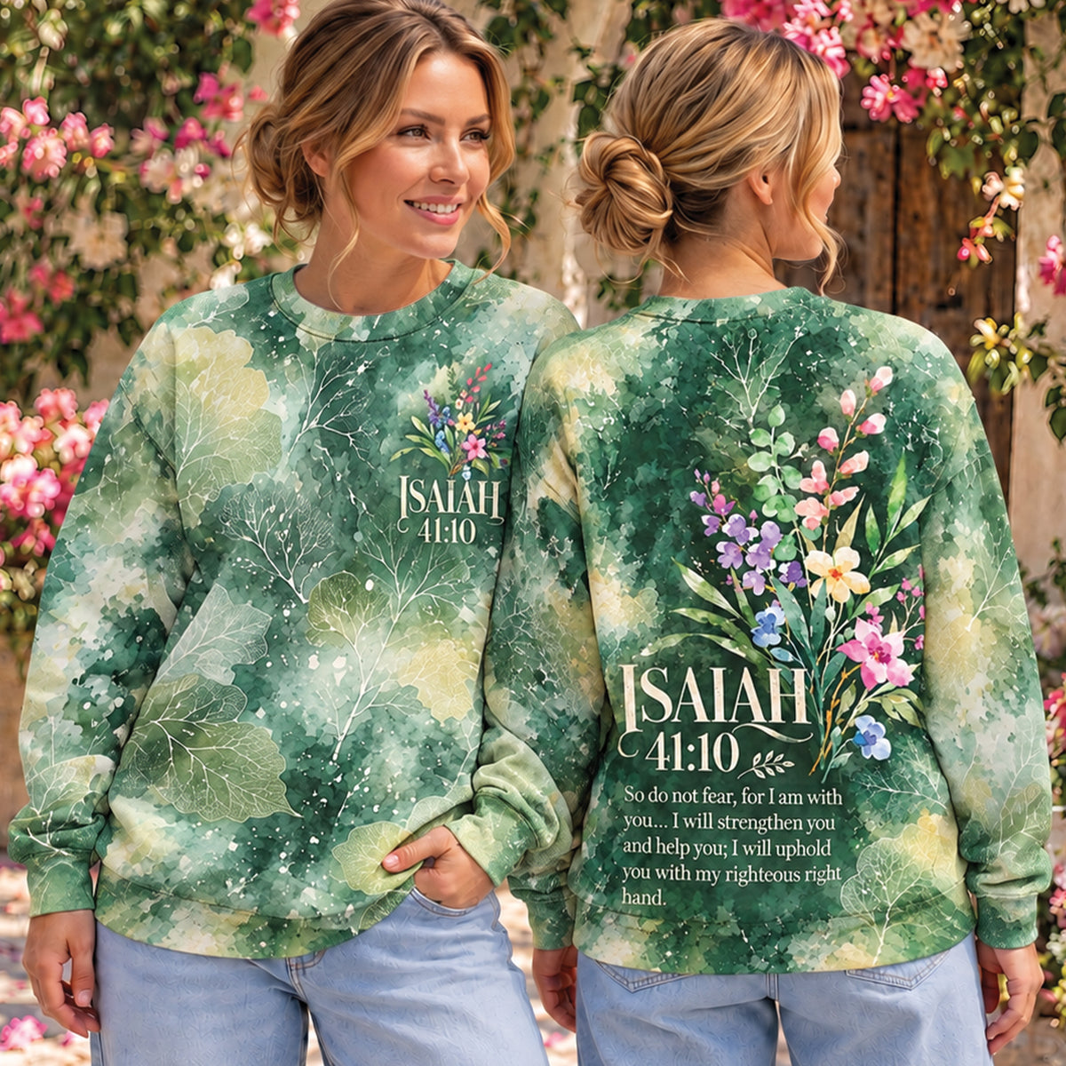 Two women modeling a green watercolor floral sweatshirt outdoors, showing both the front and back views. The sweatshirt features a botanical pattern in shades of green, yellow, and white, with a colorful floral graphic and the text 'ISRAEL 4:10' on the front and a larger version on the back with a Bible verse.